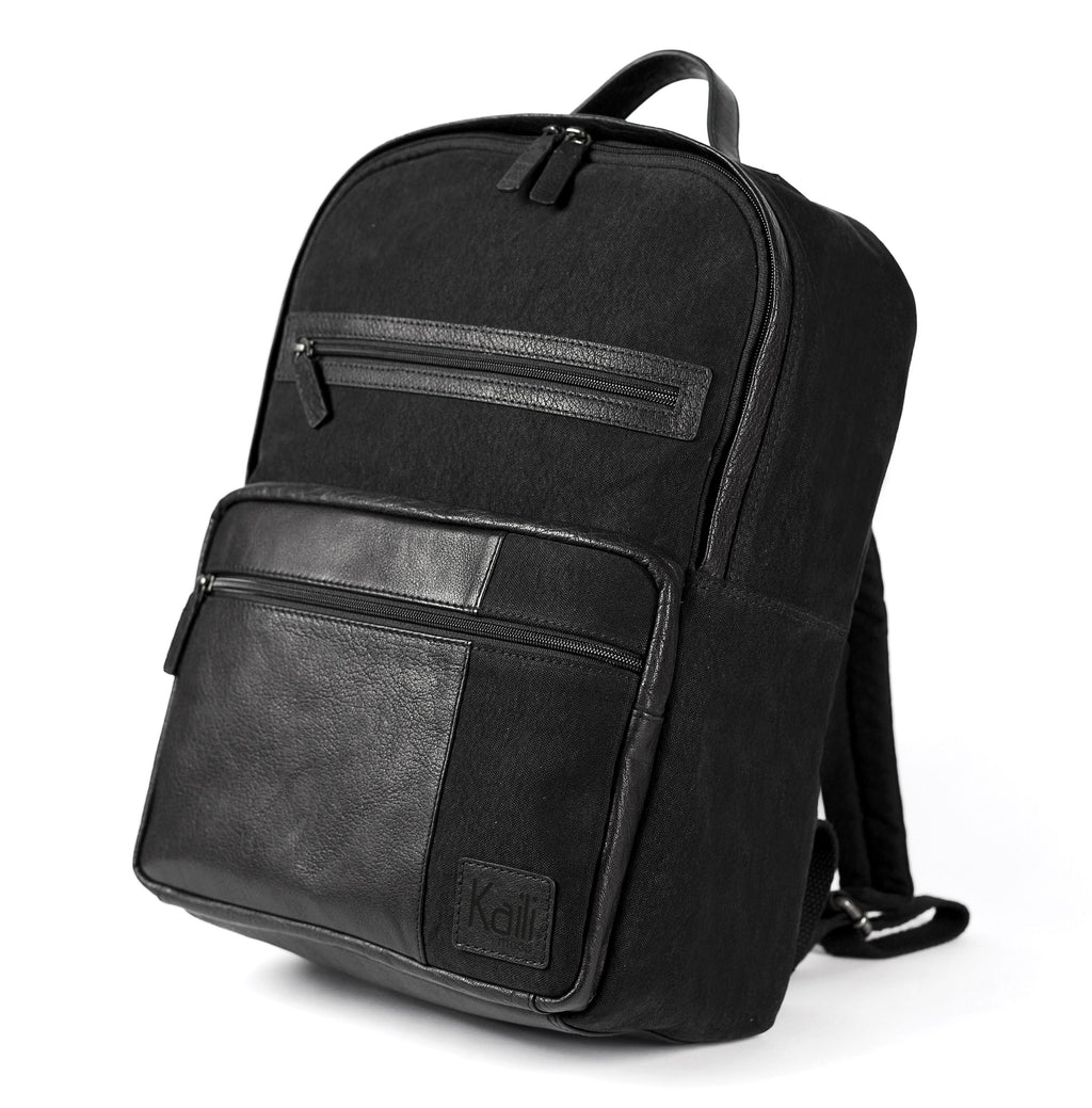 K0023AB | Zaino Porta Notebook in Canvas/Vera Pelle, pieno fiore, volanata - Colore Nero. Accessori Nickel Anticato, Chiusura con lampo. Dimensioni: cm 29 x 40 x15. Confezione: Sacchetto Tnt-0